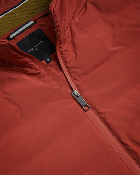 NEWWARK-Outerwear-Say yes to effortless style with the NEWWARK gilet. A gilet is the perfect lightweight coverup for warmer weather and this one's funnel neck and padding keep out the breeze. Gilet Pockets Zip fastening Funnel neck Padded Magnolia label- Ted Baker Romania